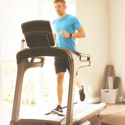 Angled shot of a model running on the Matrix TF50 Treadmill