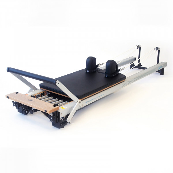 Angled view of the Merrithew At Home SPX Reformer Package With Vertical Stand