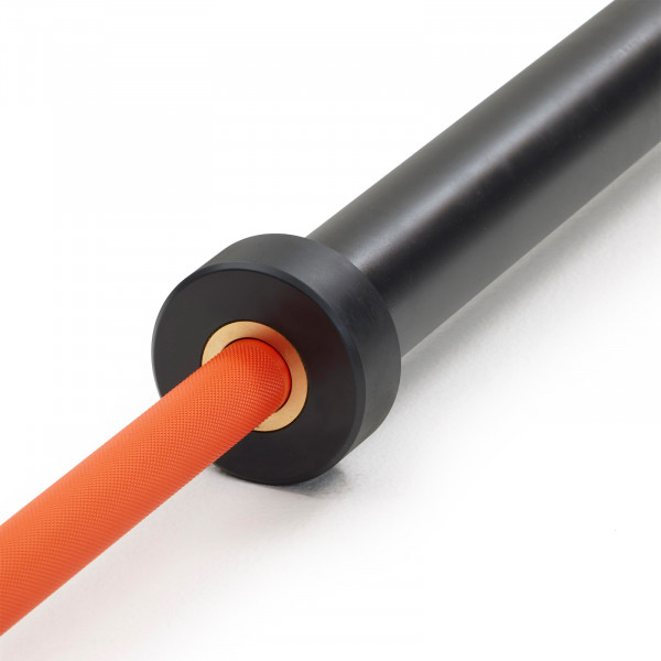 Close-up of the sleeve and knurling detail on the Nike Strength Premium Barbell 15kg in orange.