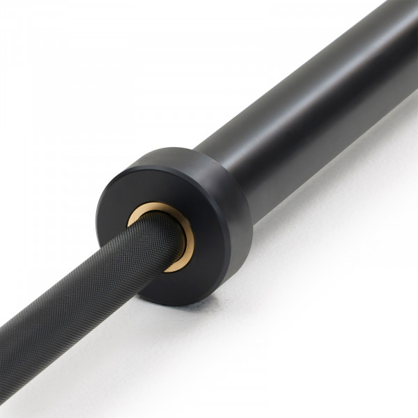 Close-up of the sleeve and knurling detail on the Nike Strength Premium Barbell 20kg in black.