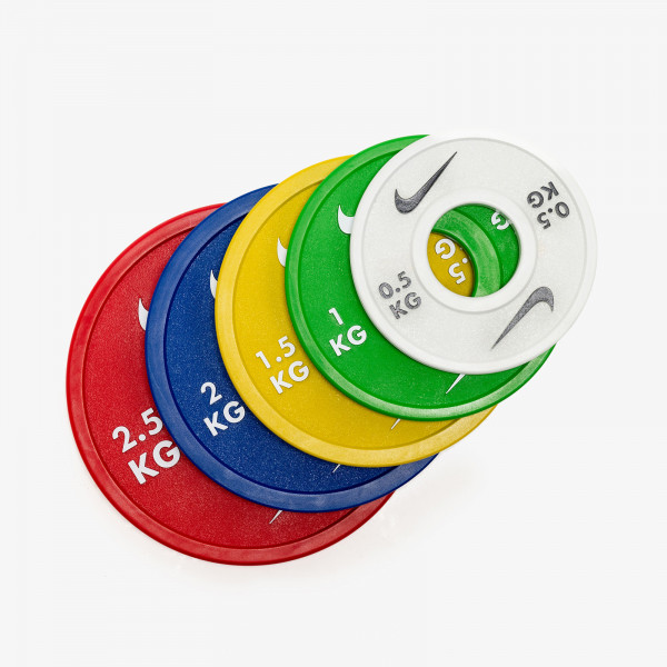 Top view of Nike Strength Change Plates in red, blue, yellow, green, and white.