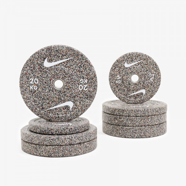 Stacked front view of 20kg and 5kg Nike Strength Grind Bumper Plates.
