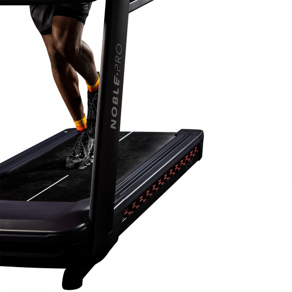 NoblePro Elite E10i Treadmill running deck close-up with model's feet