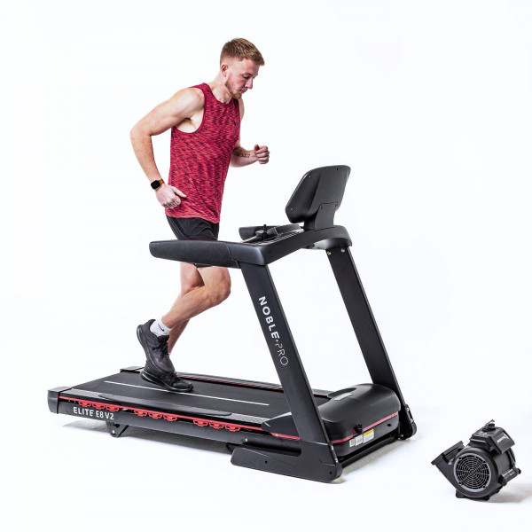 Model running on the NoblePro Elite E8ix Treadmill with fitness fan
