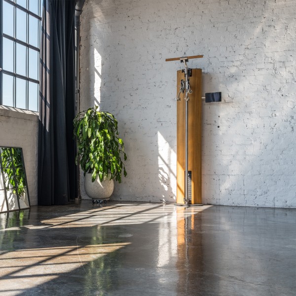 Enjoy the space-saving design and sleek aesthetics of the NOHRD SlimBeam Cable Machine, perfect for any home gym.