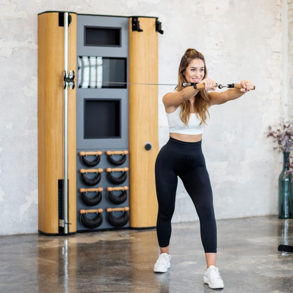 An individual engaging in a workout session with the NOHRD Wall Compact.