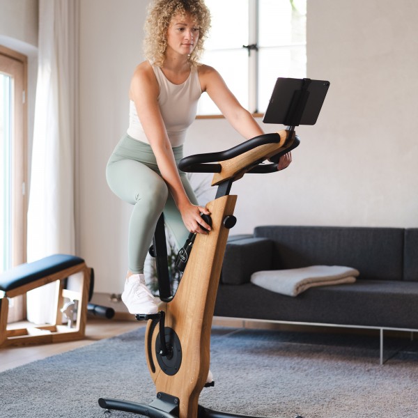 Individual exercising on the NOHRD Bike V2.
