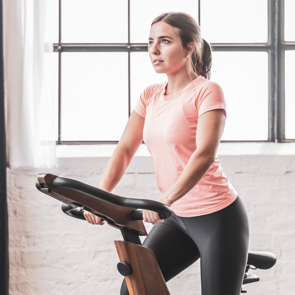 Person working out on the NOHRD Bike V2.
