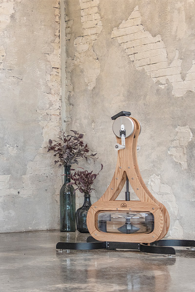 NOHRD WaterGrinder Arm Bike against a rustic wall 