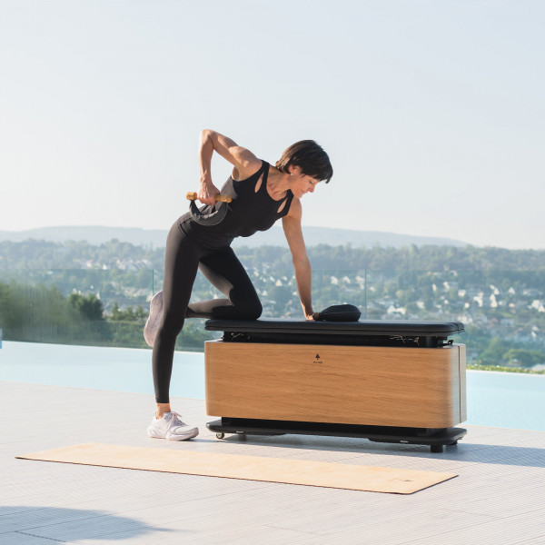 User doing bent-over row on StepBox.