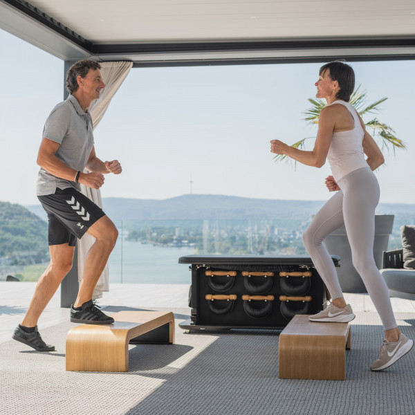 Two users stepping on NOHRD StepBox panels.