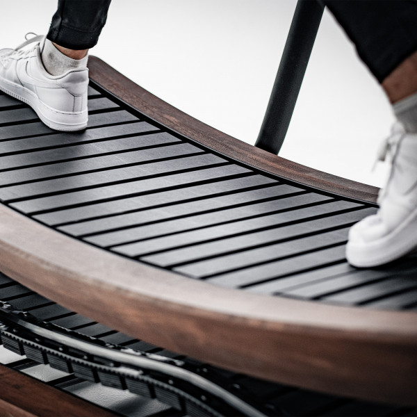 Close-up of feet running on Sprintbok V2 curved wooden slats