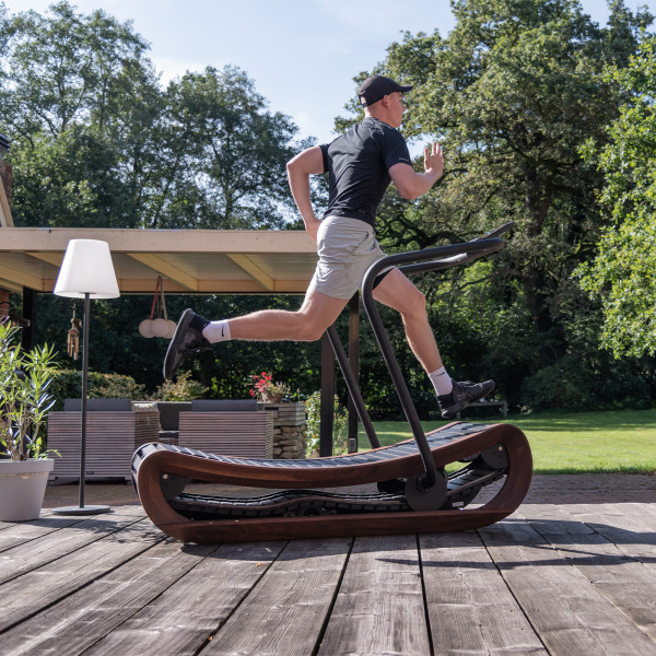 User mid-run on Sprintbok V2 placed on wooden deck