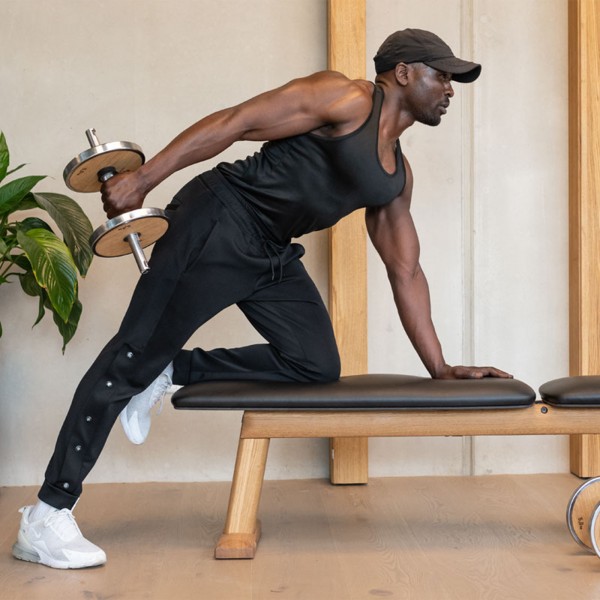 NOHRD WeightPlate Tower - demonstrating a dumbbell exercise