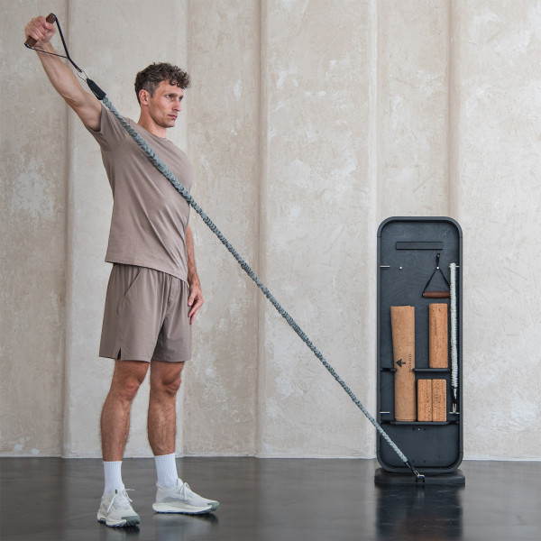 Person training with resistance band using NOHRD StepTower