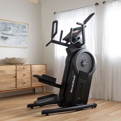 Side angled view of the NordicTrack Step Climber positioned in a home workout space 