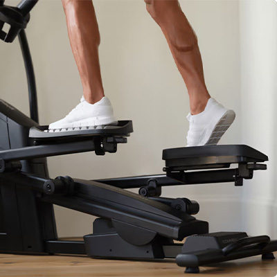 Close-up of feet on the NordicTrack AirGlide 14i Elliptical pedals during workout 
