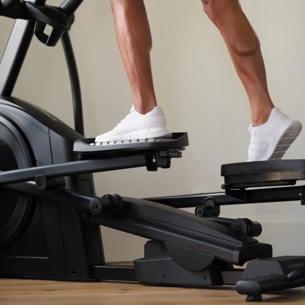 Close-up of feet on the NordicTrack AirGlide 14i Elliptical pedals during workout