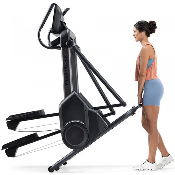 Person moving the NordicTrack X16 Elliptical Cross Trainer.