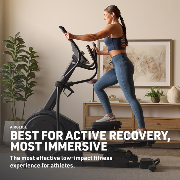 Model using the NordicTrack AirGlide LE Elliptical at home, highlighting low-impact training and active recovery