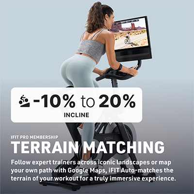 Rear angled view of a model cycling on the NordicTrack X24 Bike with incline feature overlay 