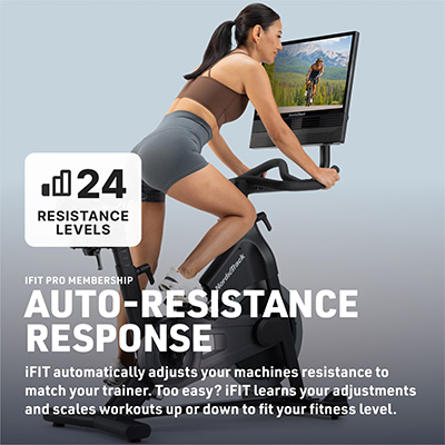 Side view of NordicTrack 24 Studio Exercise Bike with model riding and automatic resistance feature highlighted 