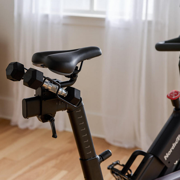 Close-up of seat and rear dumbbell rack on NordicTrack 24 Studio Exercise Bike
