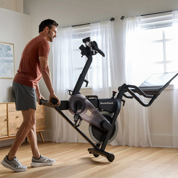 Model tilting and rolling NordicTrack 24 Studio Exercise Bike using transport wheels