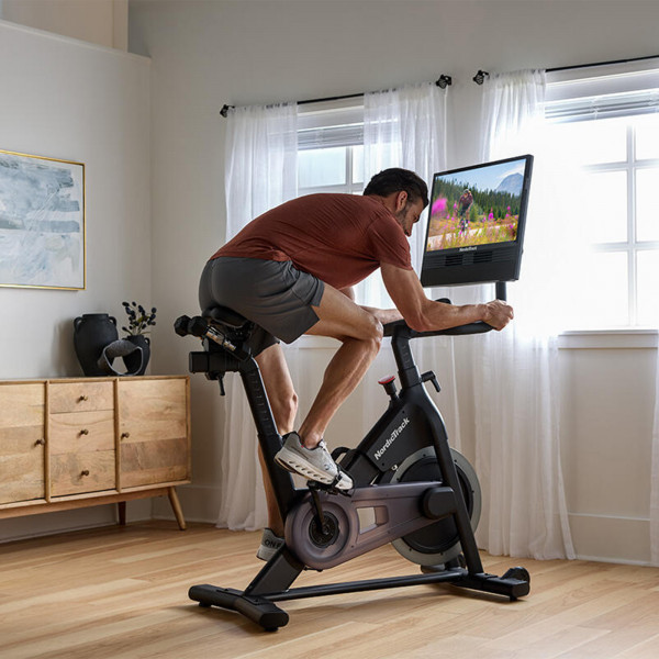 Person riding the NordicTrack S24 Studio Bike during an iFIT workout
