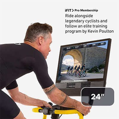Model using the NordicTrack Tour de France Indoor Bike with iFIT workout displayed on touchscreen 