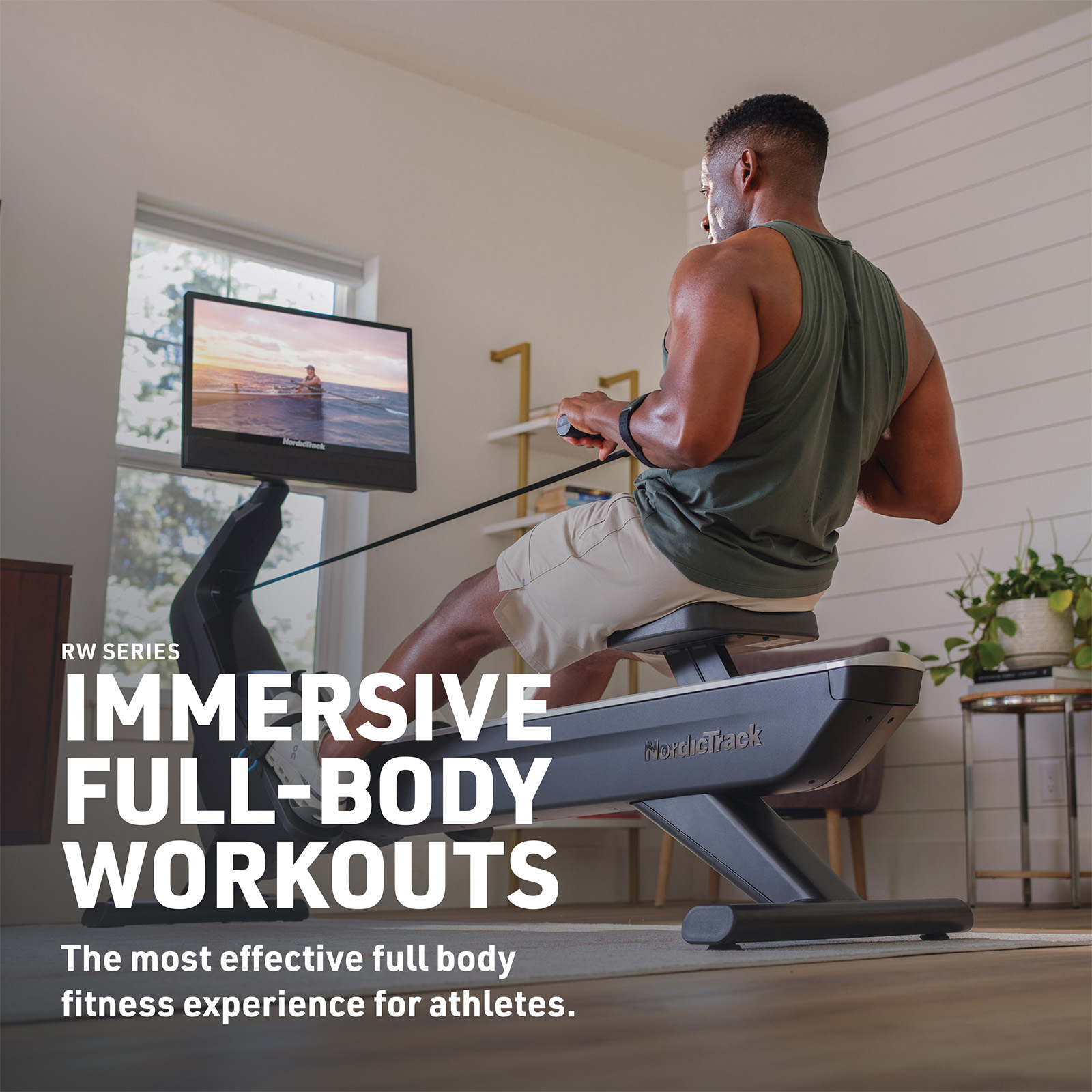 Model using NordicTrack RW900 Rower during full-body rowing workout with trainer on screen 