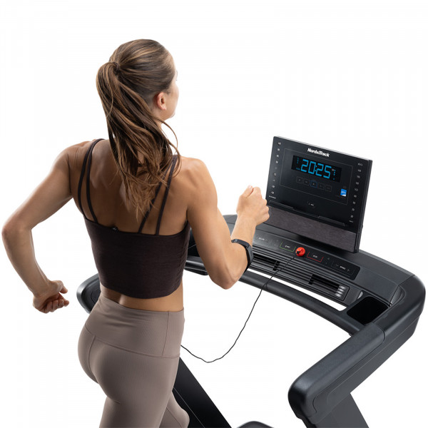 Person running on the NordicTrack Commercial LE Treadmill.