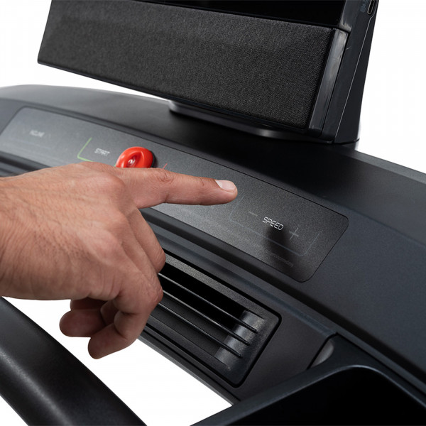 Person adjusting speed on the NordicTrack Commercial 1250 Treadmill.