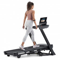 Person walking on the NordicTrack T Series 10 Treadmill at an incline.
