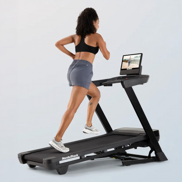 User running on the NordicTrack T Series 16 Treadmill during incline workout
