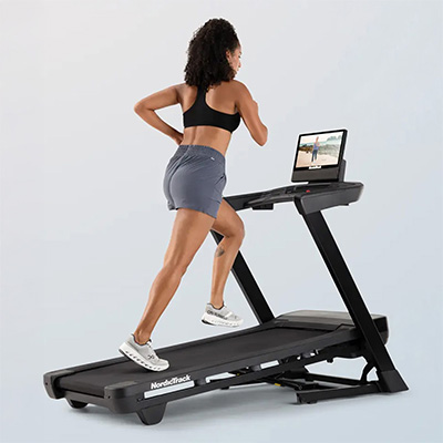Close-up of the 16-inch HD touchscreen on the NordicTrack T Series 16 Treadmill displaying workout options