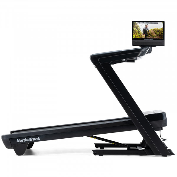 Front-right view of the NordicTrack Commercial 1750 Treadmill at an incline, with the touchscreen pivoted.