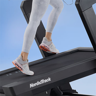 Close-up of a model running on the NordicTrack X16 Treadmill belt 