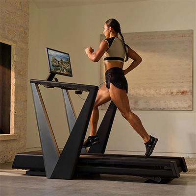 Rear view of a model running on the NordicTrack Ultra 3 Treadmill
