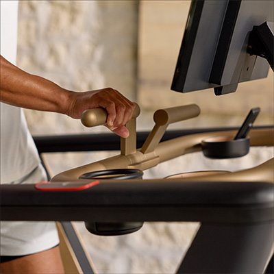 Close-up of a person adjusting controls on the NordicTrack Ultra 1 Treadmill