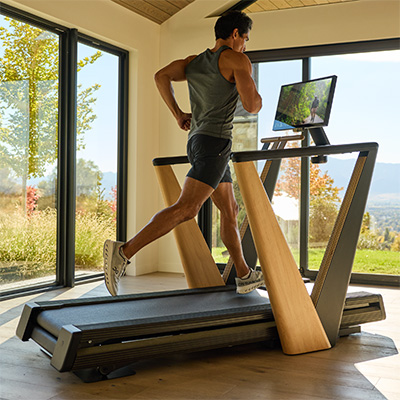 Model running on the NordicTrack Ultra 1 Treadmill in a bright home setting