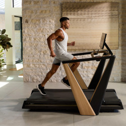 Model running on the NordicTrack Ultra 1 Treadmill in a home setting
