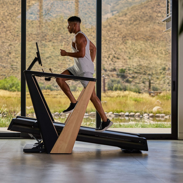 Model running on the NordicTrack Ultra 1 Treadmill at an incline