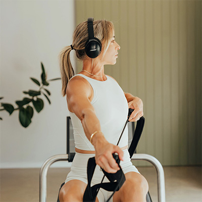 Seated rowing-style arm pull exercise on the NordicTrack Ultra 1 Reform RX-S  