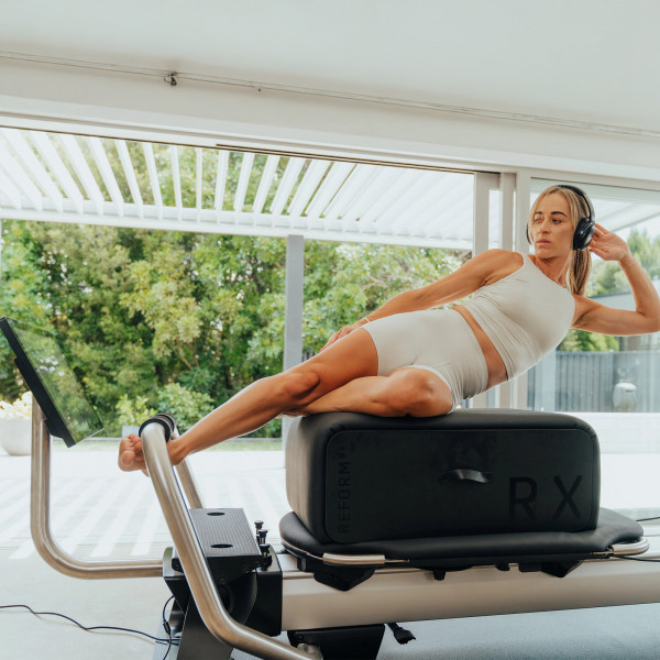 Side-lying oblique exercise on the NordicTrack Ultra 1 Reform RX-S