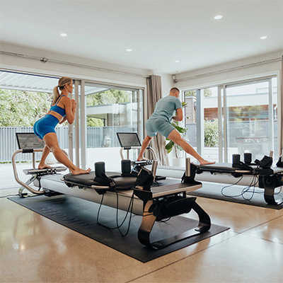 Standing lunge balance exercise on the NordicTrack Ultra 1 Reform RX-S