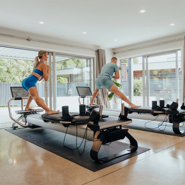 Standing lunge balance exercise on the NordicTrack Ultra 1 Reform RX-S
