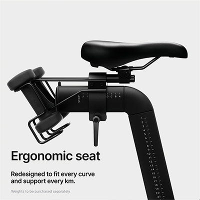 Infographic of the Peloton Cross Training Bike seat with the caption: "Ergonomic seat. Redesigned to fit every curve and support every km. Weights to be purchased separately." 