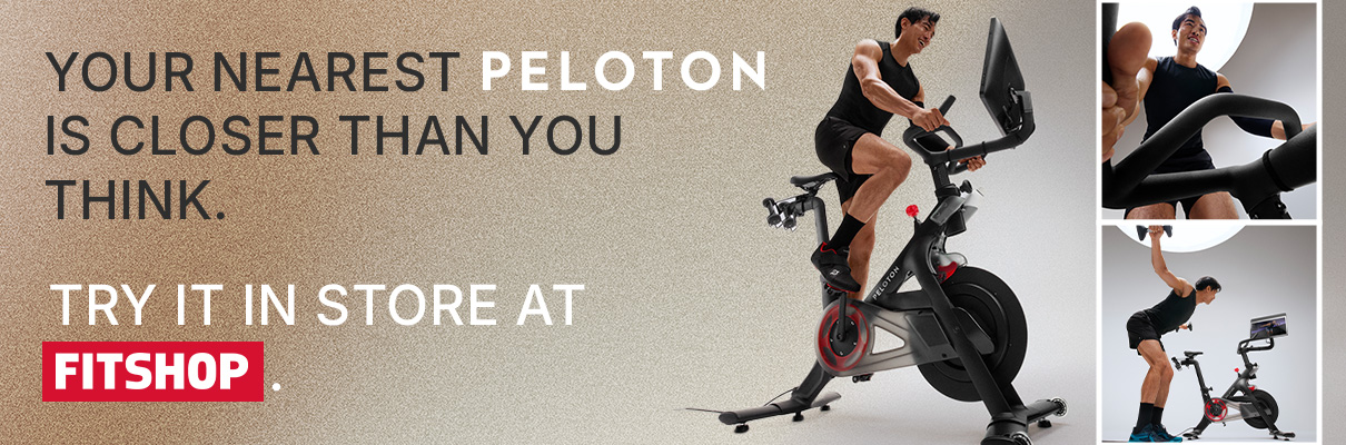 Person riding the Peloton Cross Training Bike beside promotional text encouraging in-store trials at Fitshop