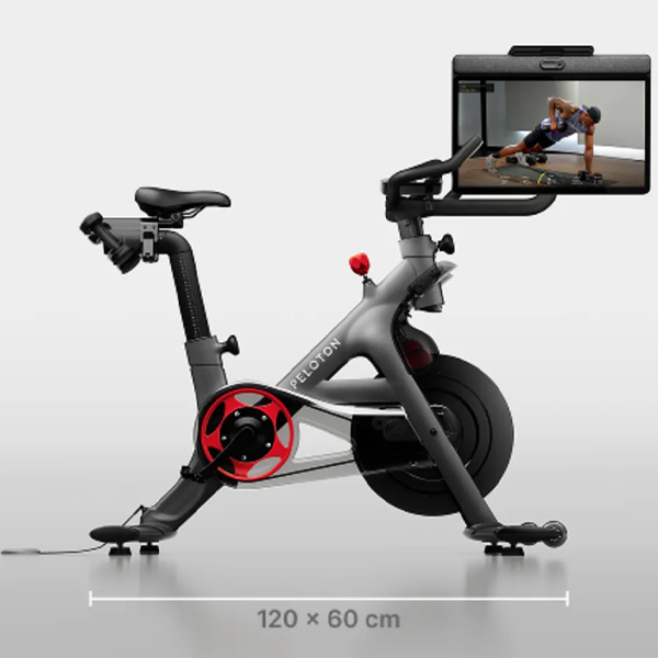 An image of the Peloton Cross Training Bike+ from the side, with a graphic showing the machine's footprint. 120 x 60 cm.